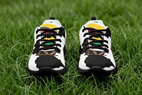 Pair of sneakers with a Guyana map and flag print on a white background