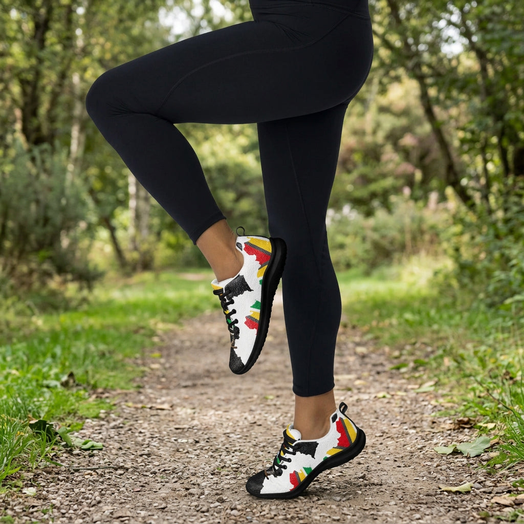 Person wearing black leggings and colorful sneakers on a white background