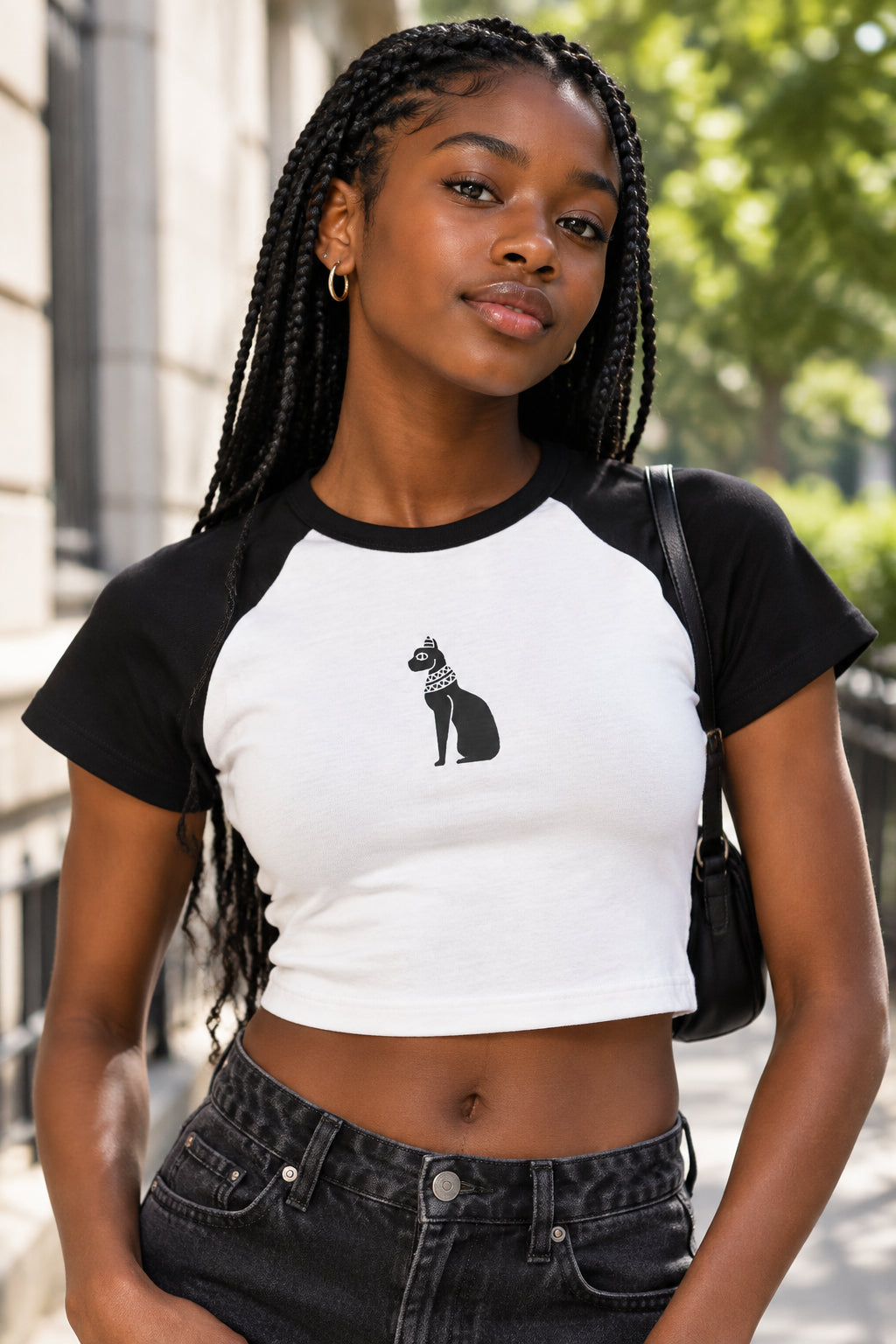 White t-shirt with black sleeves and a Bastet logo on a white background