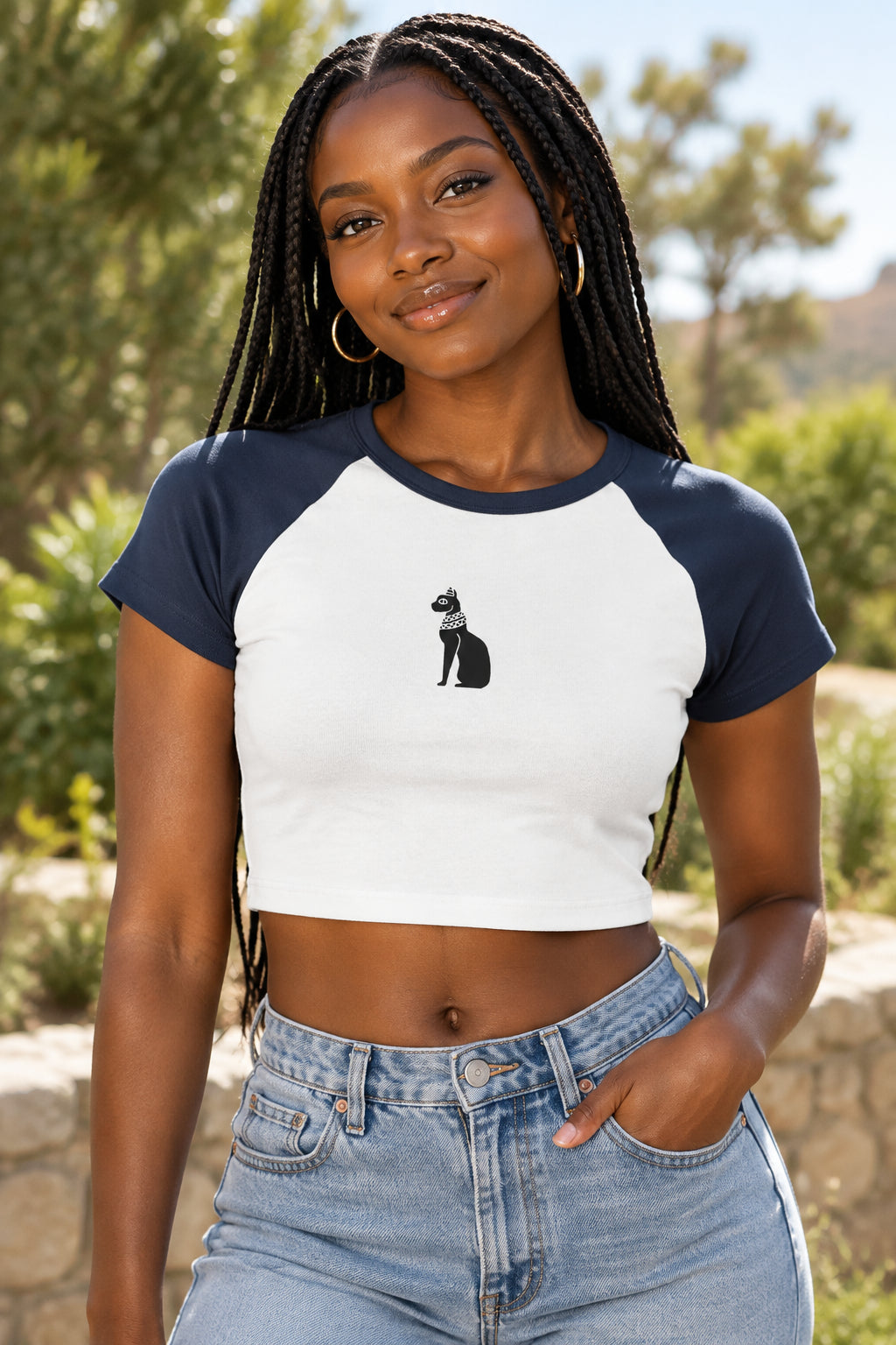 White t-shirt with navy sleeves featuring a black cat graphic on a white background