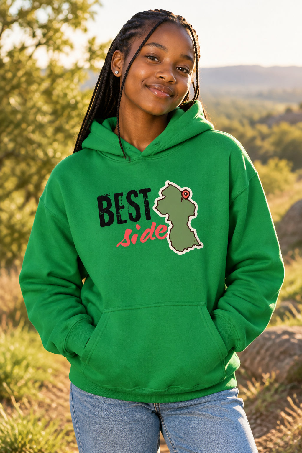 A bright green pullover hoodie with a front graphic that reads 'BEST Side' in black and red lettering, alongside a gray-green Guyana map outline with a red pin. The hoodie is shown on a plain white background.