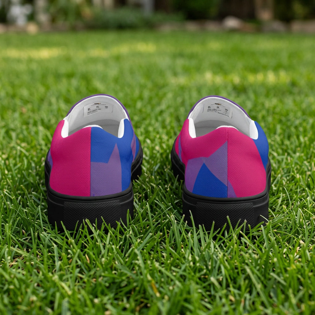 Pair of shoes with a black sole, purple and blue top on a white background