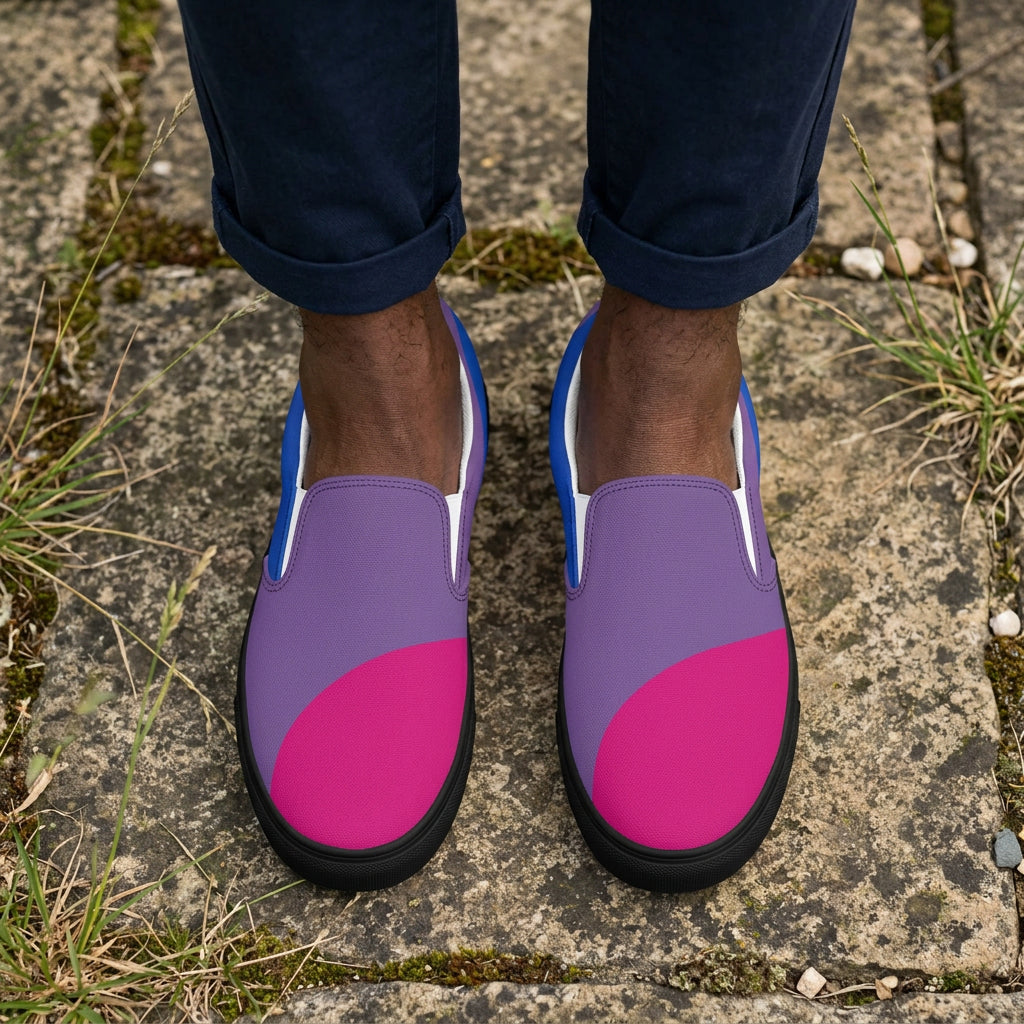 Pair of slip-on shoes with pink and purple design on a white background