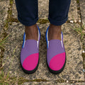 Pair of slip-on shoes with pink and purple design on a white background
