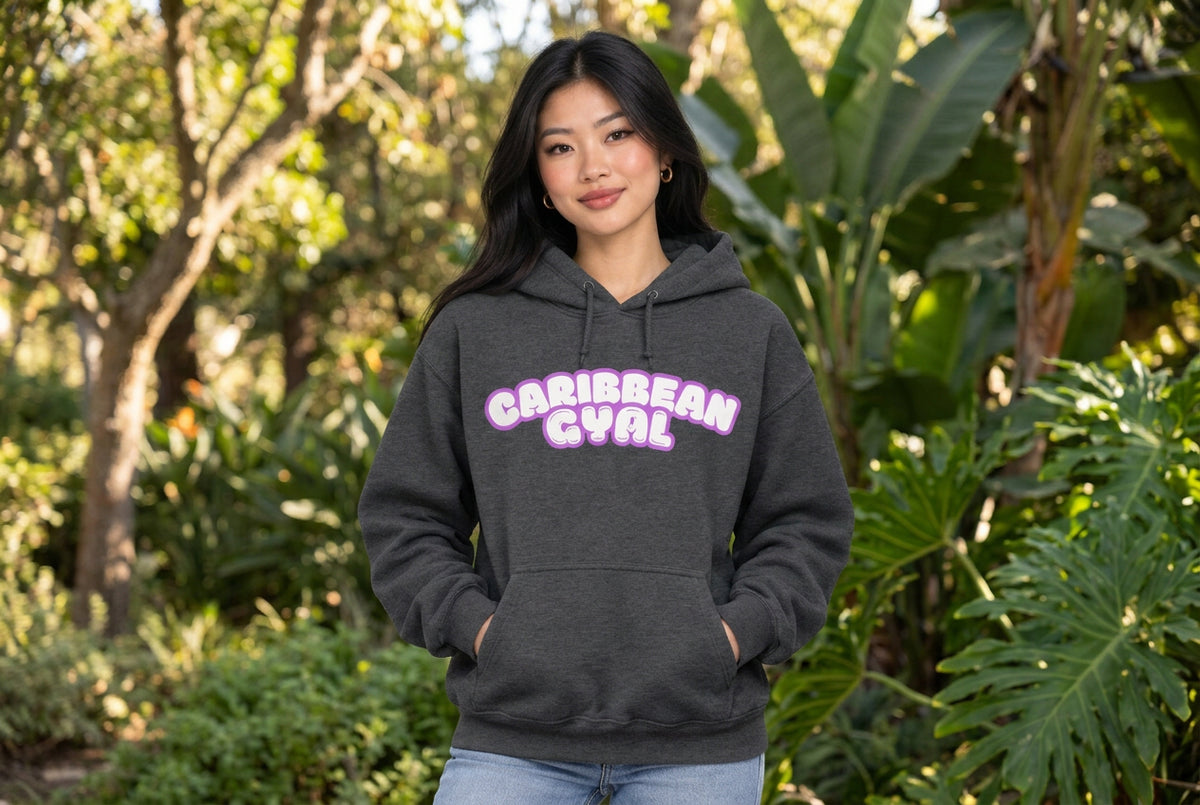 A dark heather gray pullover hoodie with a front kangaroo pocket and a pink and white bubble-letter graphic reading 'CARIBBEAN GYAL' across the chest, shown on a plain white background.