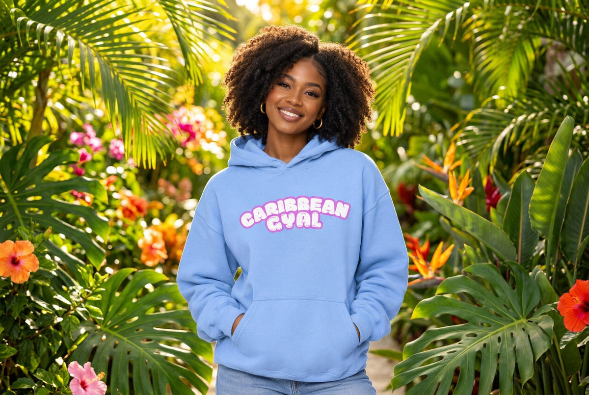 A light blue pullover hoodie with a front kangaroo pocket and a pink bubble-letter graphic reading 'CARIBBEAN GYAL' across the chest, shown on a plain white background.