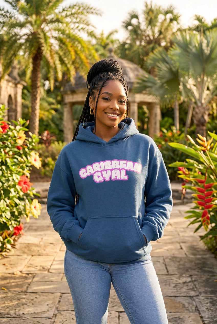 A blue pullover hoodie with a front kangaroo pocket and a pink bubble-letter graphic reading 'CARIBBEAN GYAL' across the chest, shown on a plain white background.