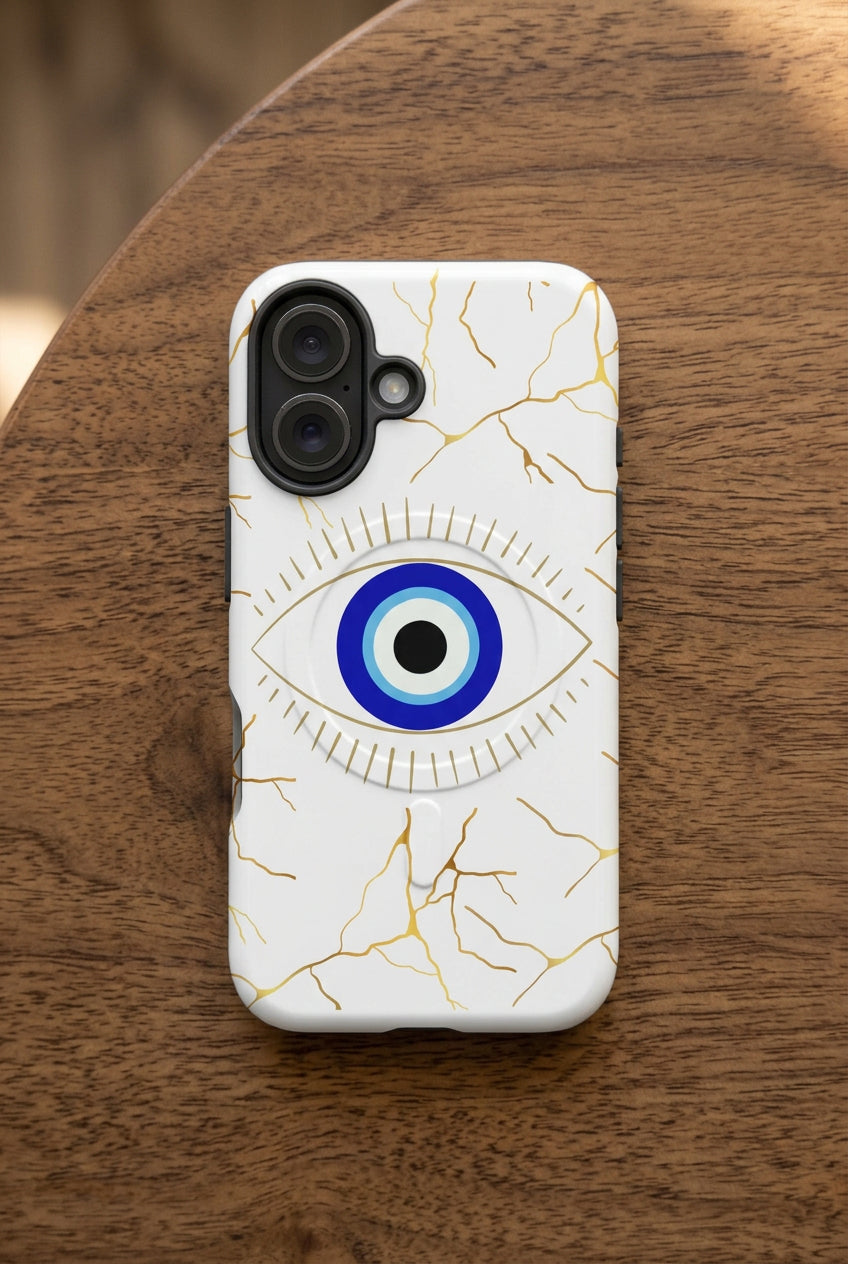Phone case with evil eye and gold design on a white background
