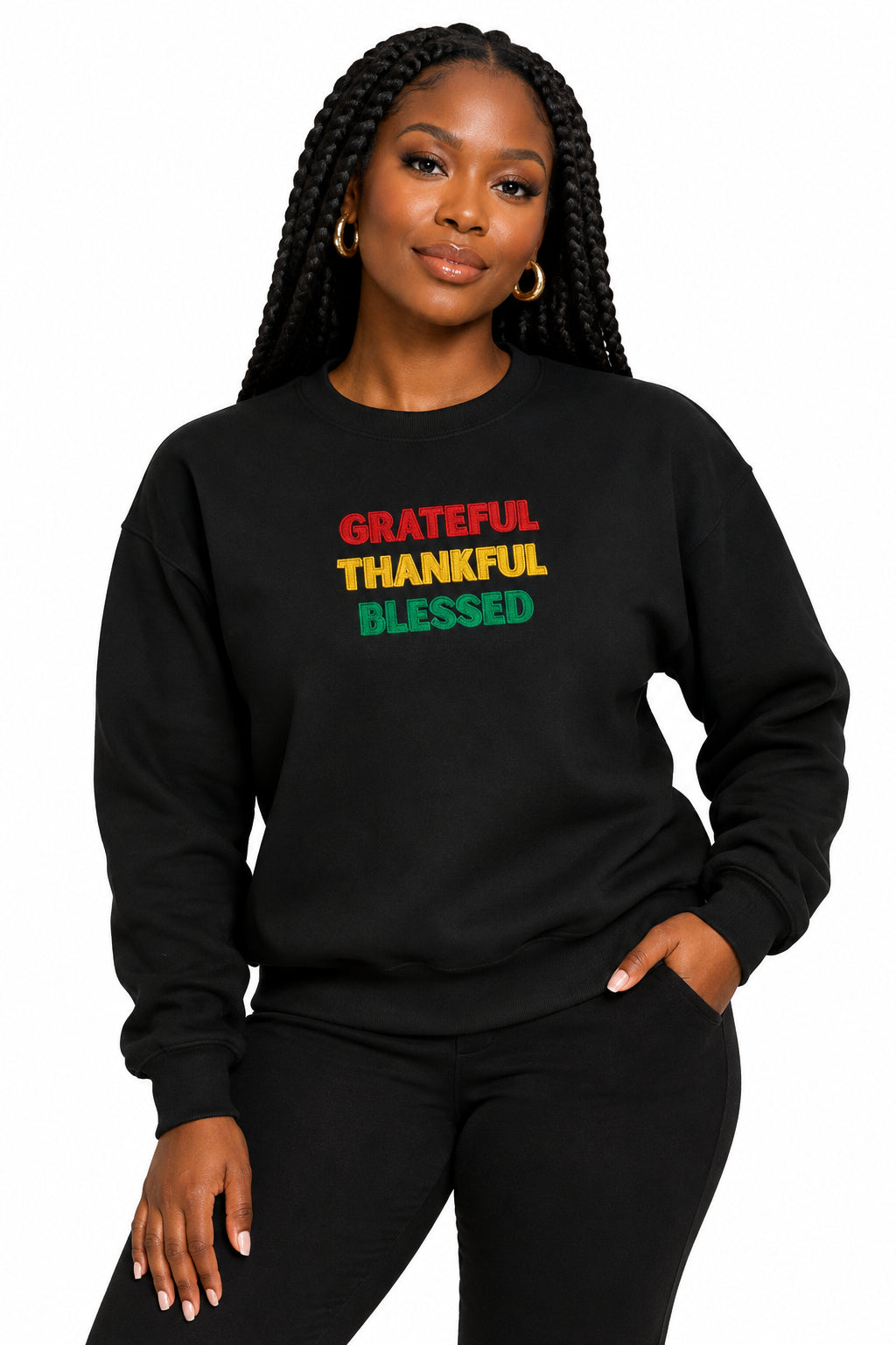A black crewneck sweatshirt with the words 'GRATEFUL', 'THANKFUL', and 'BLESSED' printed on the chest in red, yellow, and green, respectively, shown against a plain white background.
