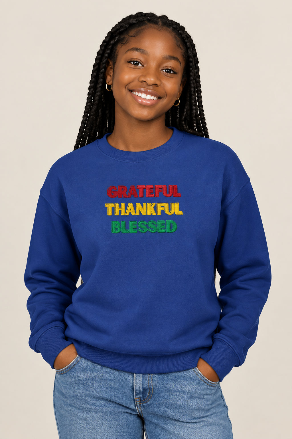 A royal blue crewneck sweatshirt with a graphic on the chest that reads 'Grateful, Thankful, Blessed 