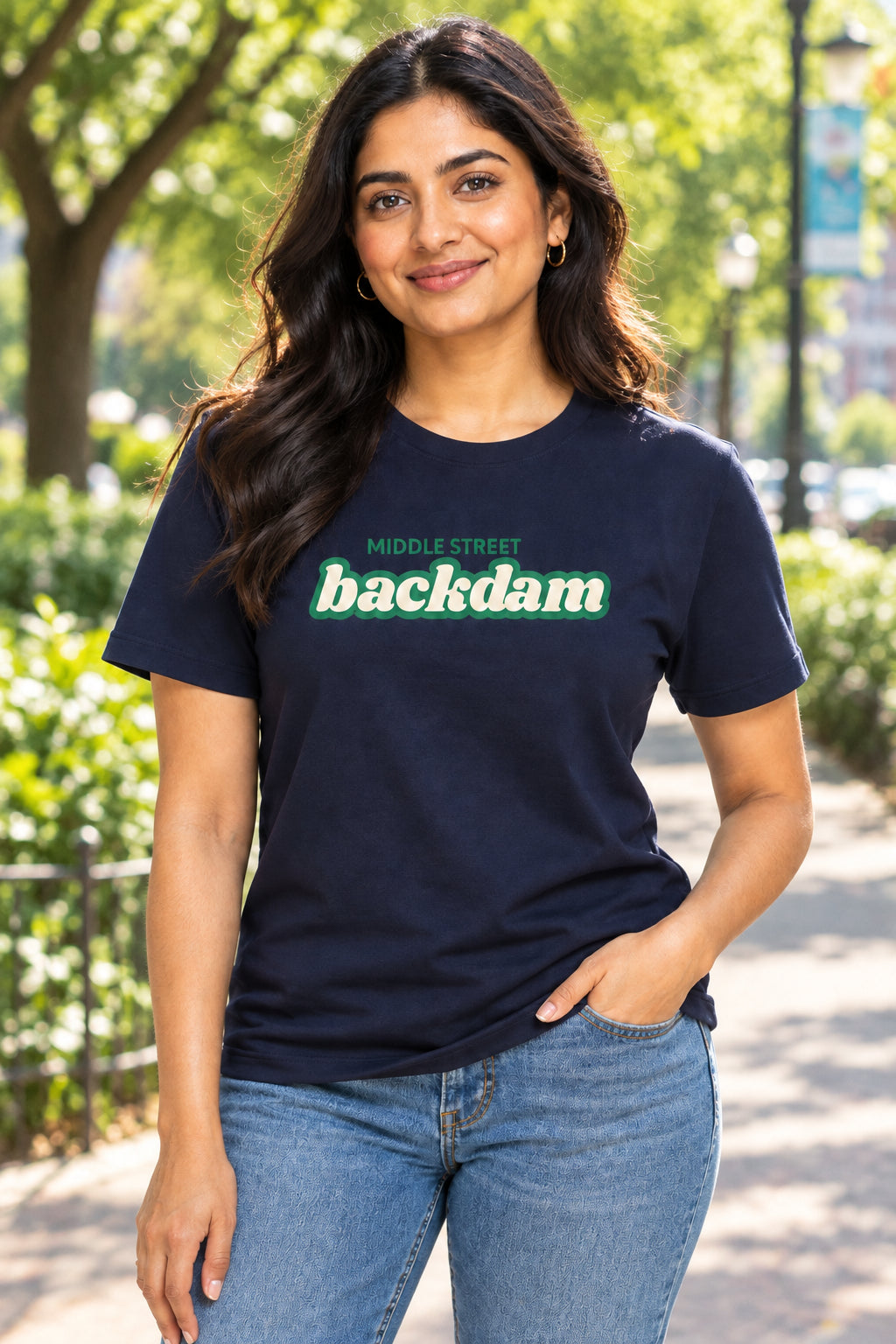 A Navy short-sleeve crewneck t-shirt featuring a green graphic print on the chest that reads 'MIDDLE STREET backdam' in a retro font.