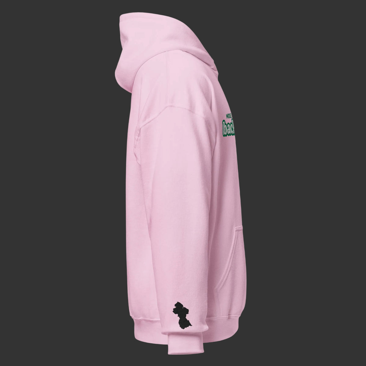 A light pink pullover hoodie shown from the side profile on a solid white background. The hoodie features a small black Guyana map silhouette graphic on the lower left sleeve 