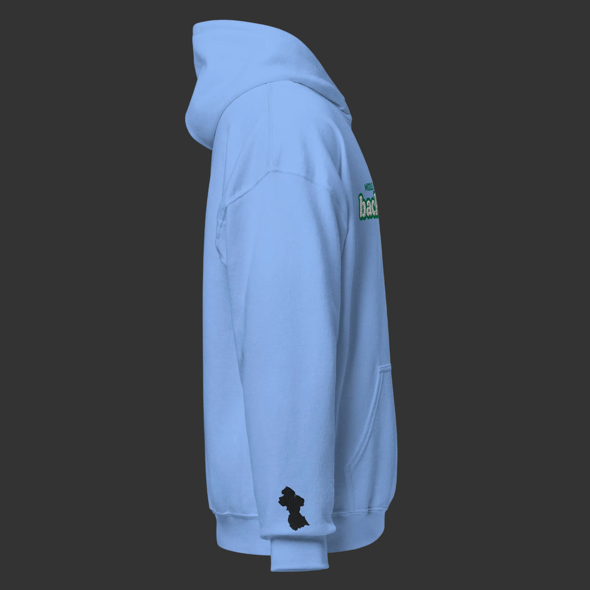 A light blue pullover hoodie shown from the side profile on a solid white background. The hoodie features a small black Guyana map silhouette graphic on the left sleeve cuff and a green and white graphic on the upper right shoulder.