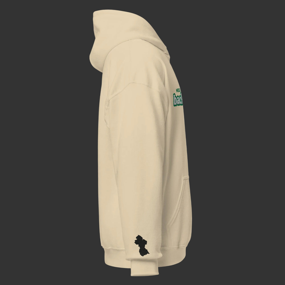 A side profile view of a beige hoodie on a white background, featuring a green graphic on the upper right shoulder and a black silhouette of Guyana map on the left sleeve.