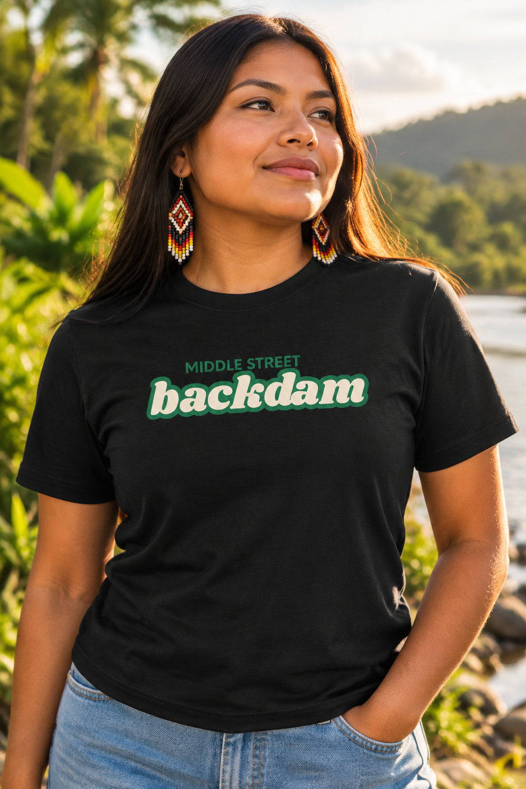 A black short-sleeve crewneck t-shirt featuring a green graphic print on the chest that reads 'MIDDLE STREET backdam' in a retro font.