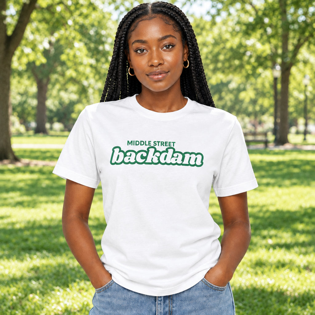 An white short-sleeve crewneck t-shirt featuring a green graphic on the chest that reads 'MIDDLE STREET backdam' in a retro bubble font.