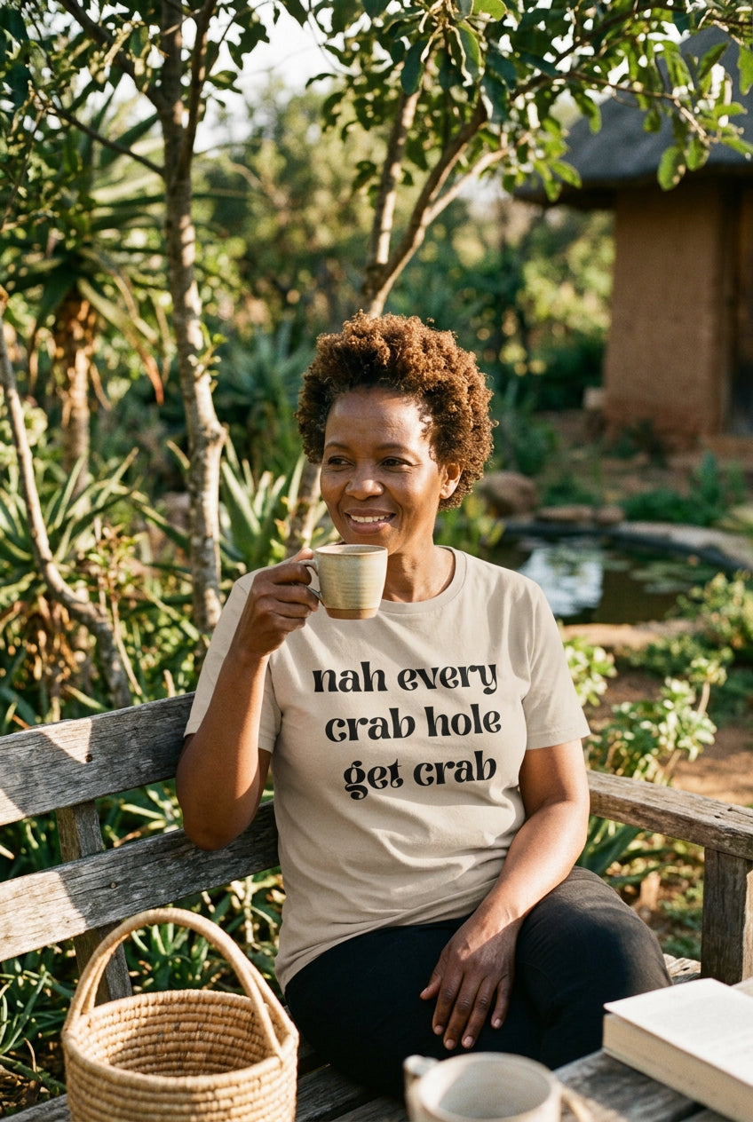 Beige t-shirt with black Nah every crab hole get crab text on a white background