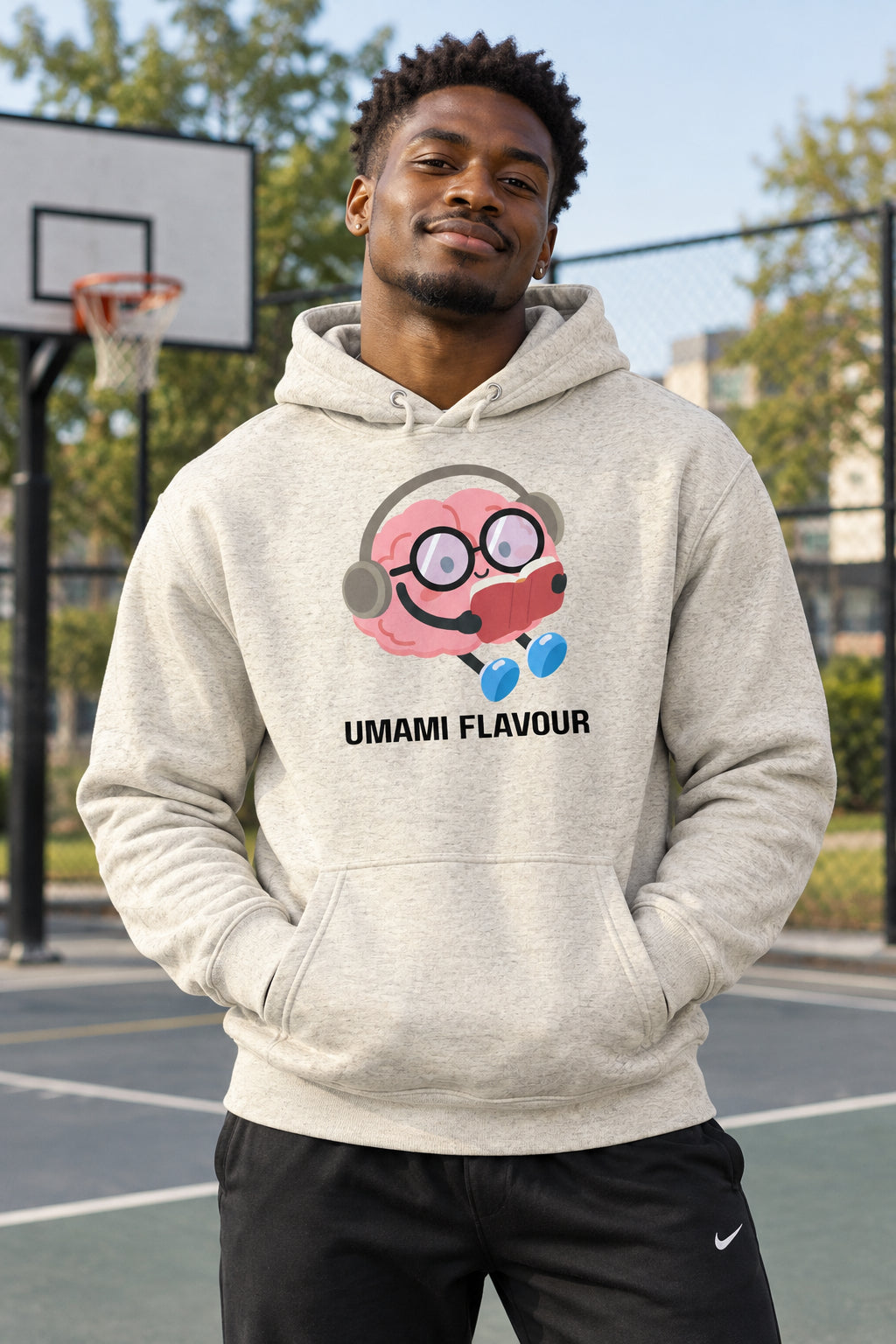 Beige hoodie with a cartoon character and 'Umami Flavour' text on a white background