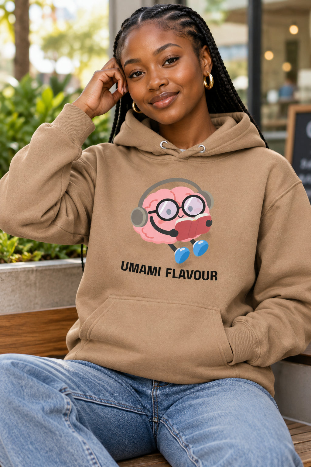 Brown hoodie with a cartoon character and 'Umami Flavour' text on a white background