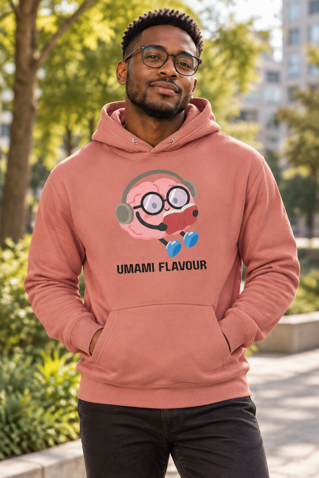 Coral hoodie with a cartoon character and 'Umami Flavour' text on a white background
