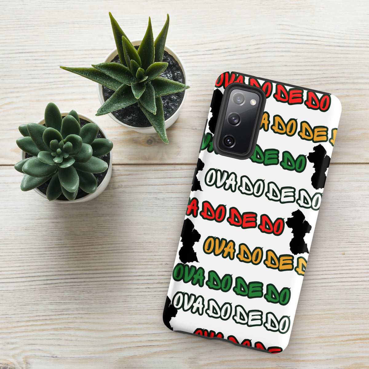 A white Samsung Galaxy phone case featuring a repeating graphic pattern of the phrase 'Ova do de do' in red, yellow, and green, interspersed with black silhouette graphics of the Republic of Guyana