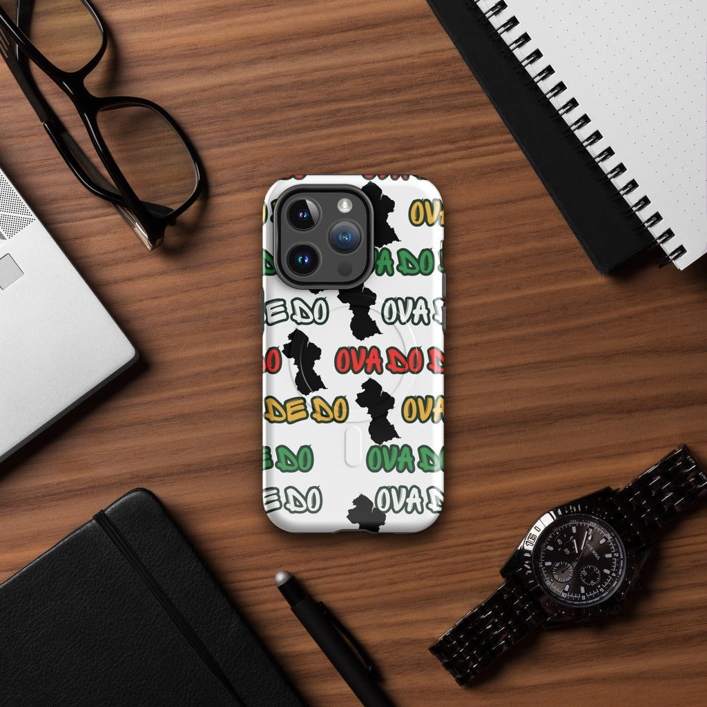 Phone case with black design on a wooden desk with glasses, laptop, and watch.