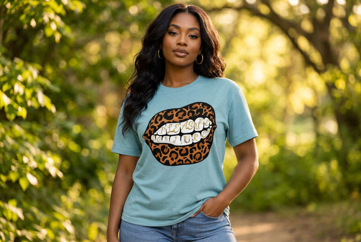 Light blue t-shirt with leopard print lips graphic and text on a white background