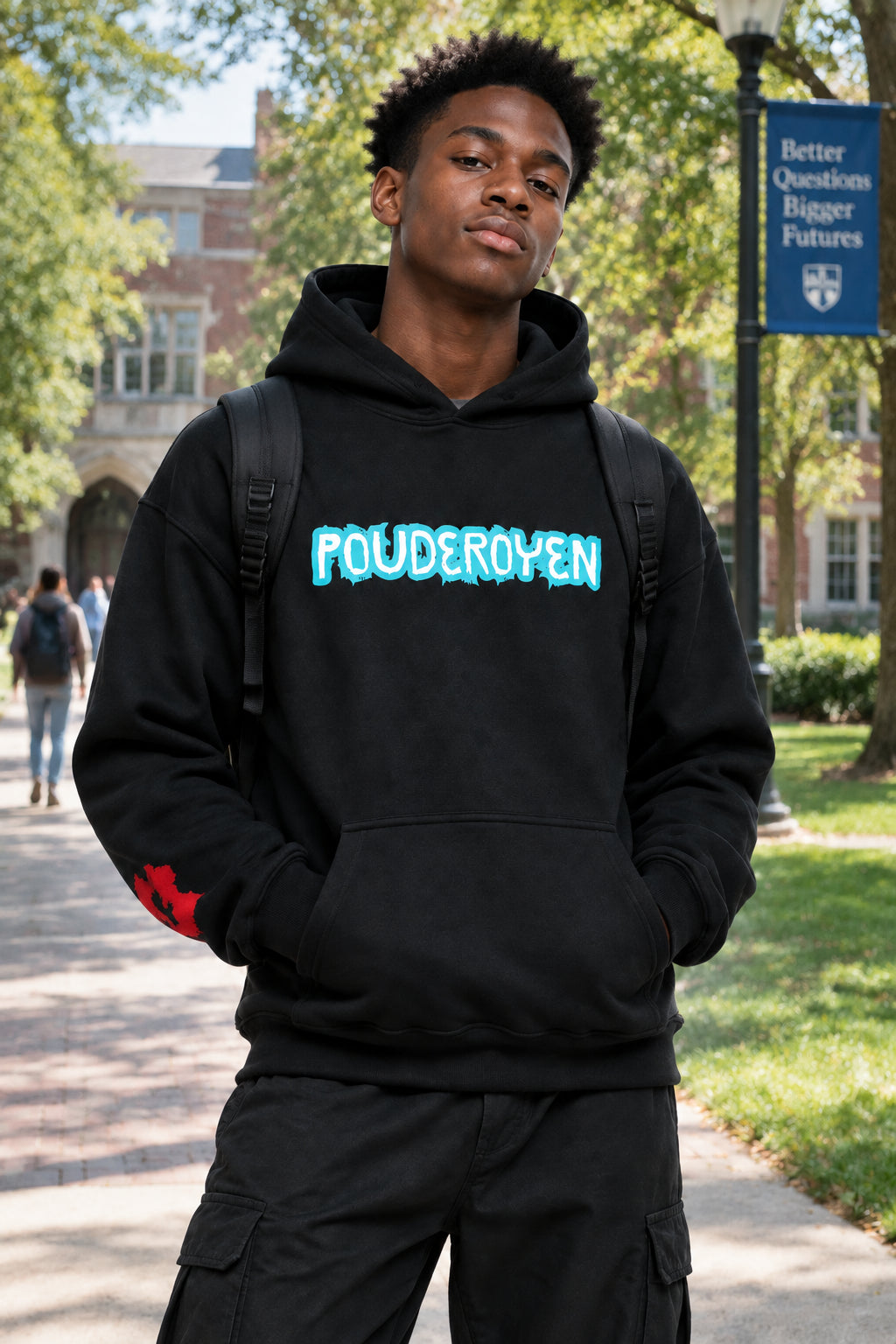 A black pullover hoodie with 'POUDEROYEN' printed across the chest in a bright blue, dripping font. The hoodie features a front kangaroo pocket and ribbed cuffs and hem, shown against a plain white background.