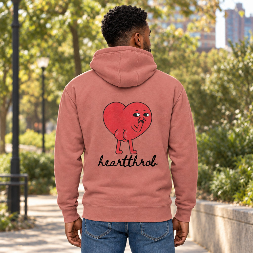 Pink hoodie with a cartoon heart and 'heartthrob' text on the back against a white background