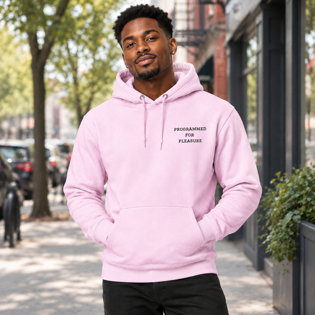 Pink hoodie with text 'PROGRAMMED FOR PLEASURE' on a white background on the chest against a white background