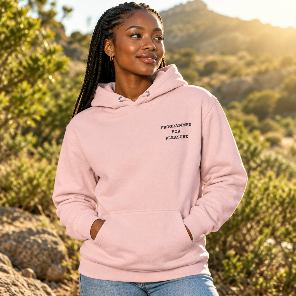 Pink hoodie with text 'PROGRAMMED FOR PLEASURE' on a white background on a white background