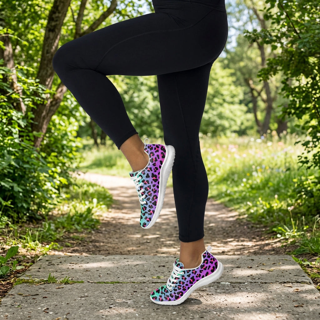 Person wearing black leggings and gray sneakers on a white background
