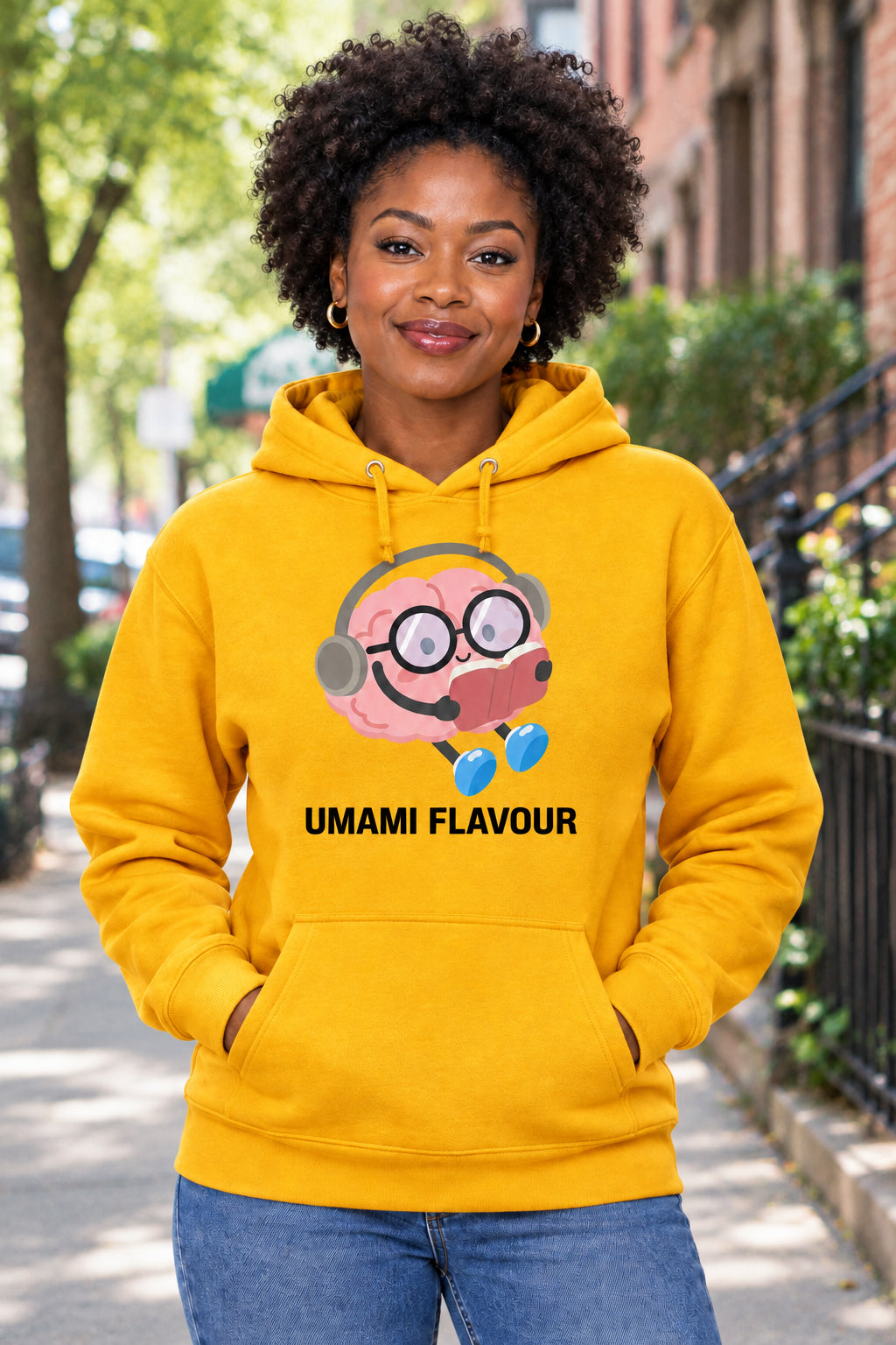 Gold hoodie with a cartoon character and 'Umami Flavour' text on a white background
