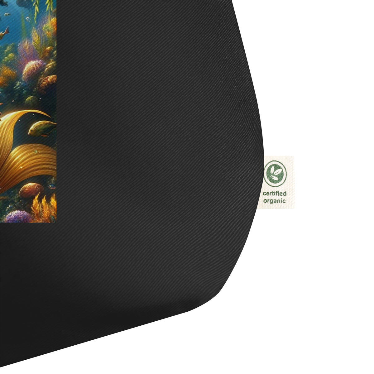Black tote bag with a colorful underwater scene and a certified organic label on a white background
