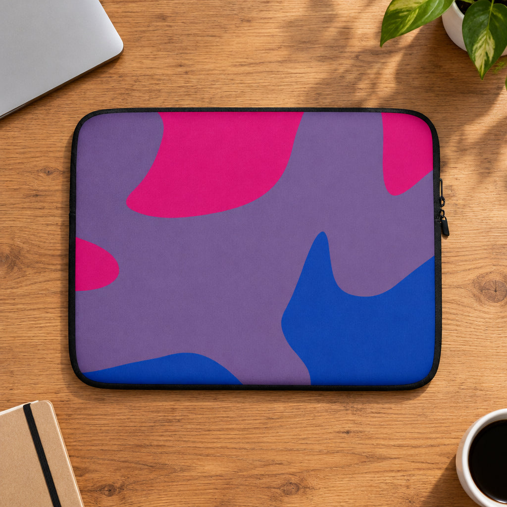 Laptop sleeve with pink and blue abstract pattern on a white background