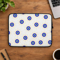 Laptop sleeve with blue eye pattern on a white background