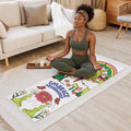 Decorative yoga mat with colorful design on a wooden floor in a living room.
