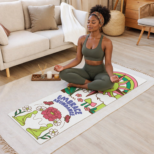 Decorative yoga mat with colorful design on a wooden floor in a living room.