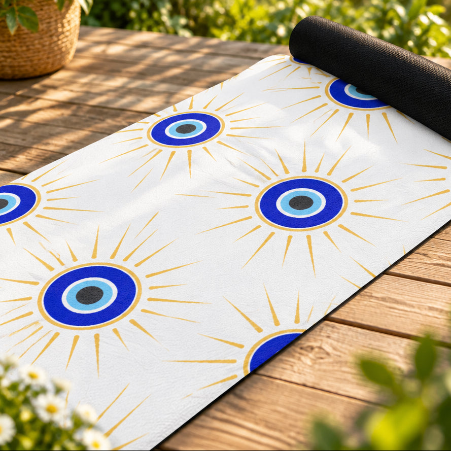 Yoga mat with blue eye design on a white background